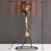Handcrafted iron art figure lamp with woven rope design and lantern-style light, decorative table lamp for home décor.