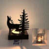 Deer silhouette shadow candle holder with forest design casting warm ambient light