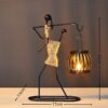 Handcrafted iron art figurine carrying a lantern, rustic decorative table lamp for home decor