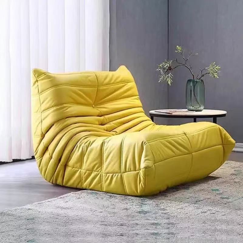 Yellow modern lazy lounge chair with soft sponge filling for living room décor.