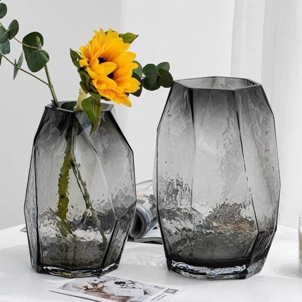 Two Transparent Geometric-Textured Decorative Vases (One Holding a Yellow Flower)