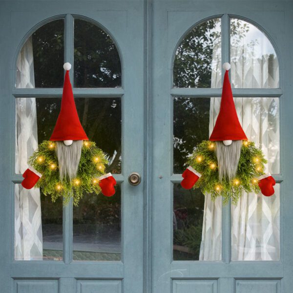 Two Christmas Gnome Decorative Ornaments (Red Hats, Green Foliage) Displayed on Arched Window