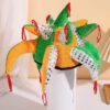 Colorful Multi-Legged Decorative Ornament (Green, Orange, Yellow & Red Accents) Placed on White Cup
