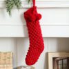 Red Knit-Style Sock-Shaped Decorative Ornament (Hanging Display With Christmas Greenery Accent)
