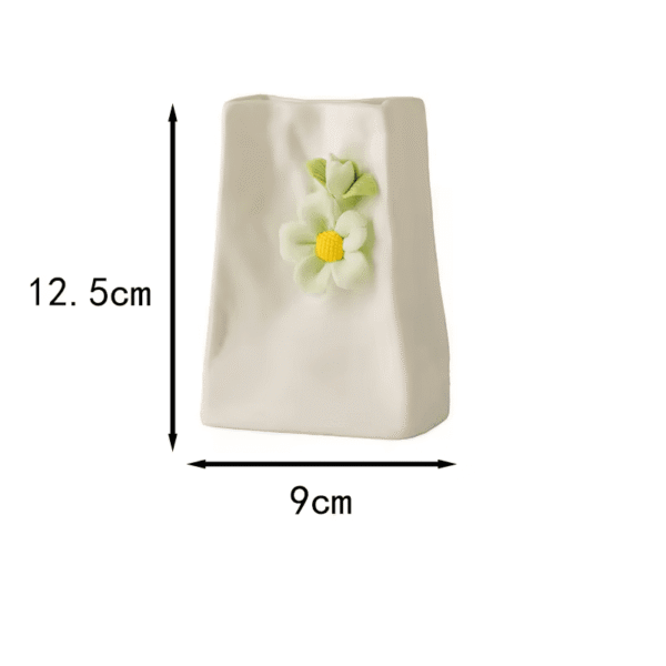 A cute healing-style white ceramic vase with 3D hand-sculpted green dual flower decorations and a subtle wrinkled texture. Dimensions: 12.5cm height × 9cm width. Displayed against a clean white background, it’s ideal for small fresh flower arrangements or desktop decor