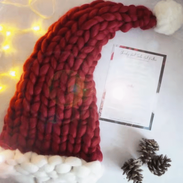 Red Knitted Santa Hat with Festive Lighting Background - Holiday Decor Accessory