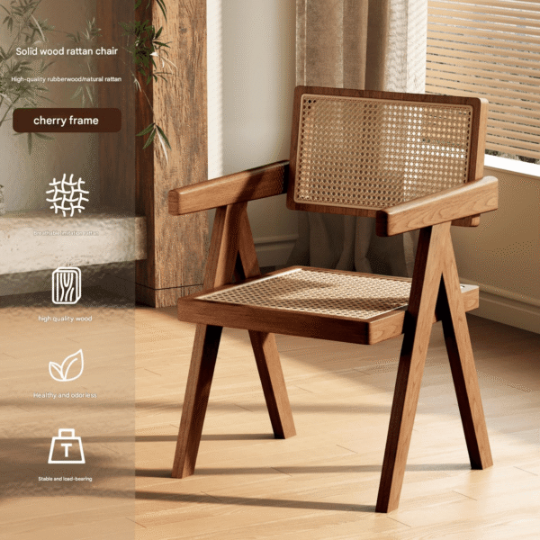 A mid-century modern armchair featuring a solid cherry wood frame and handwoven natural rattan upholstery on the backrest and seat. Displayed in a warm, sunlit living room with wooden flooring and sheer curtains, it blends retro charm with breathable comfort.