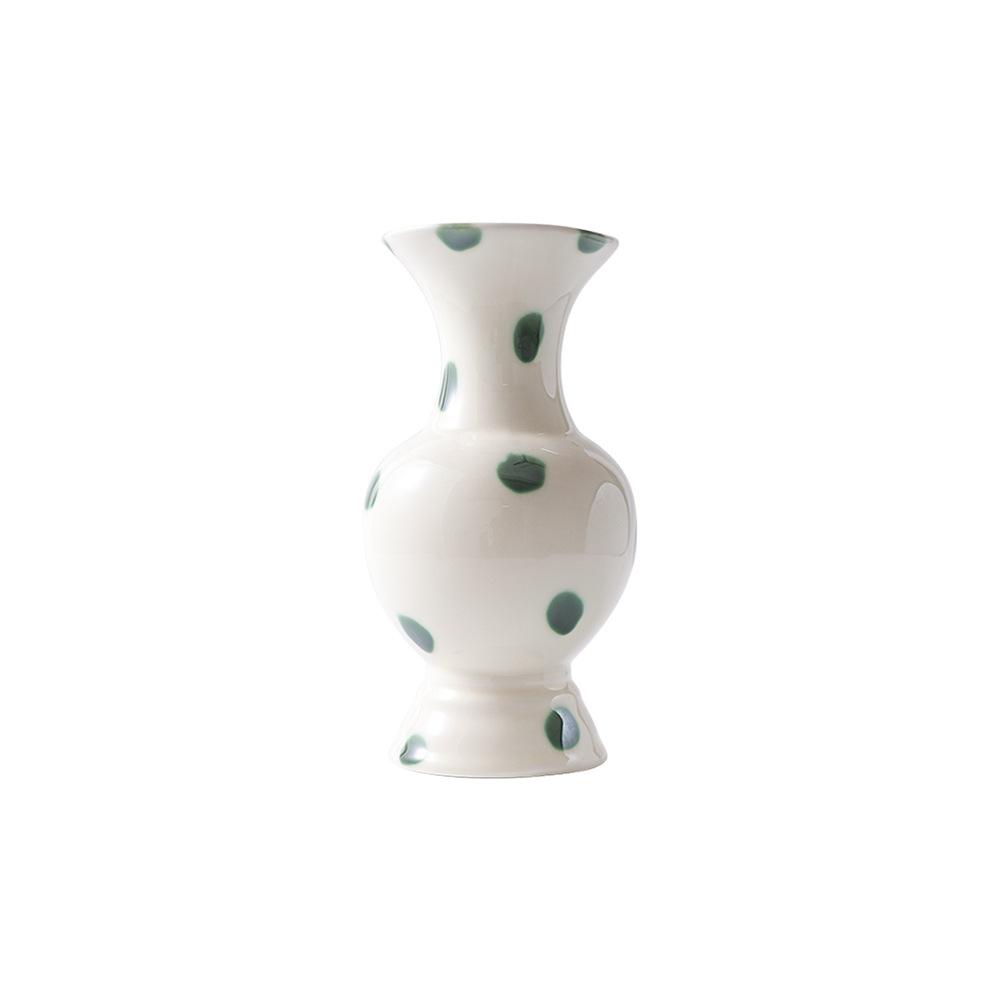 Round-neck green dot ceramic vase on white background