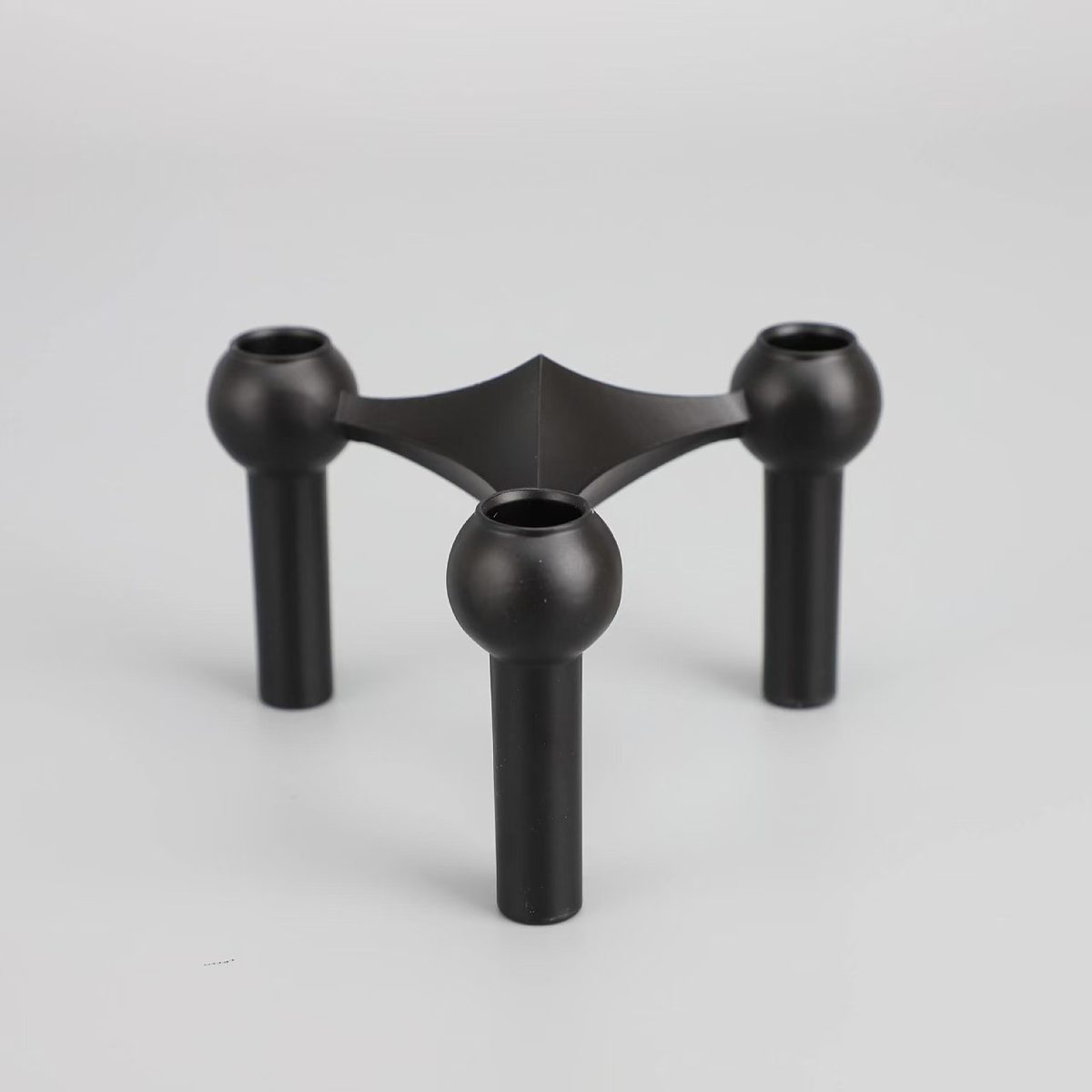 Matte black finish — three-arm candelabra
