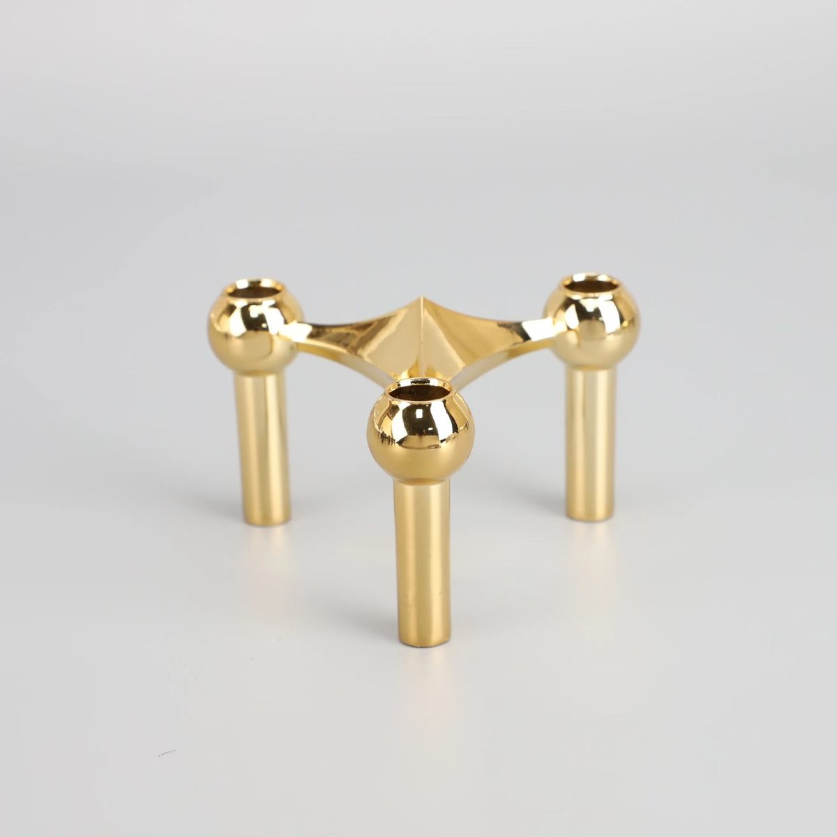 Polished gold finish — three-arm candelabra