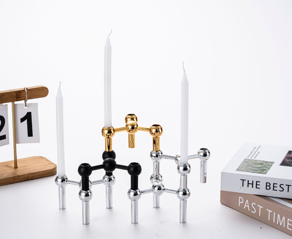 Mixed-finish display: matte black, polished chrome and gold stacked together