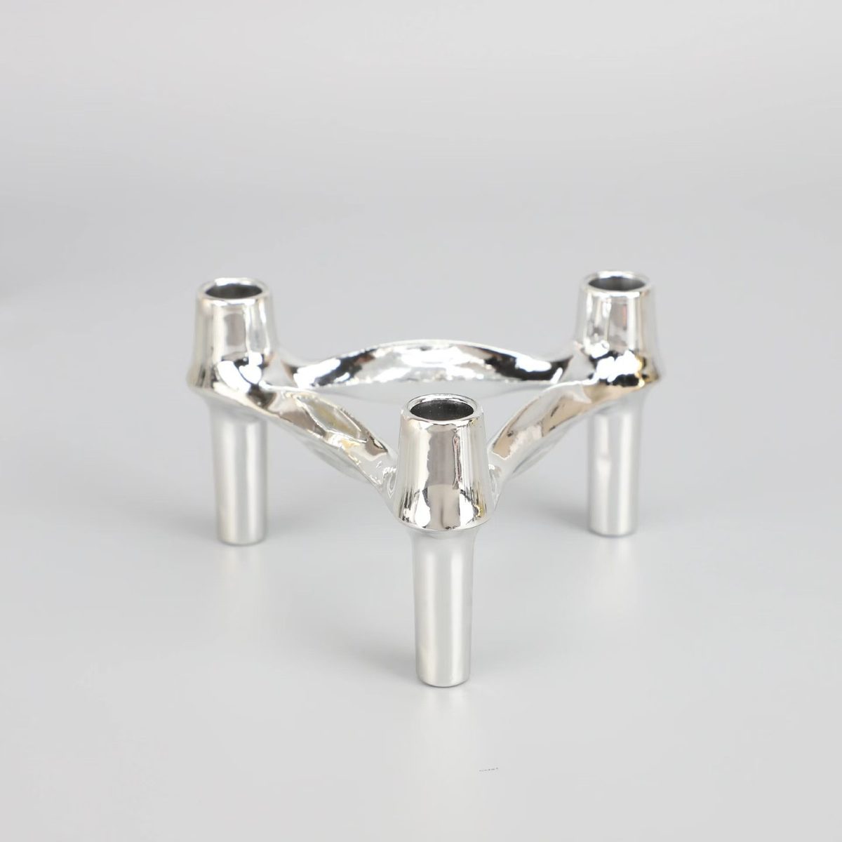 Polished chrome finish — three-arm candelabra