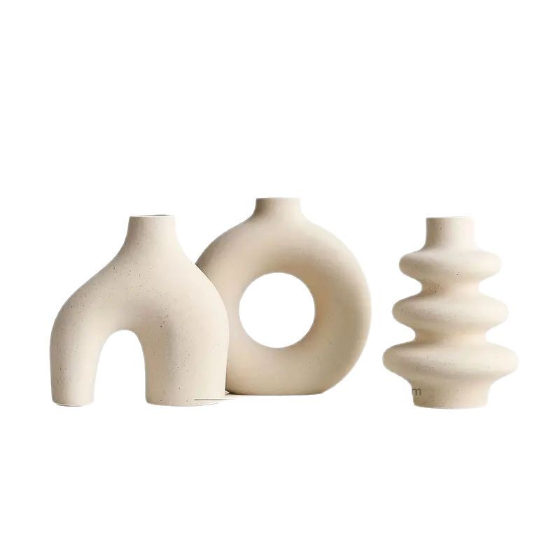 Studio shot of the unglazed speckled bisque ceramic vase set on white background