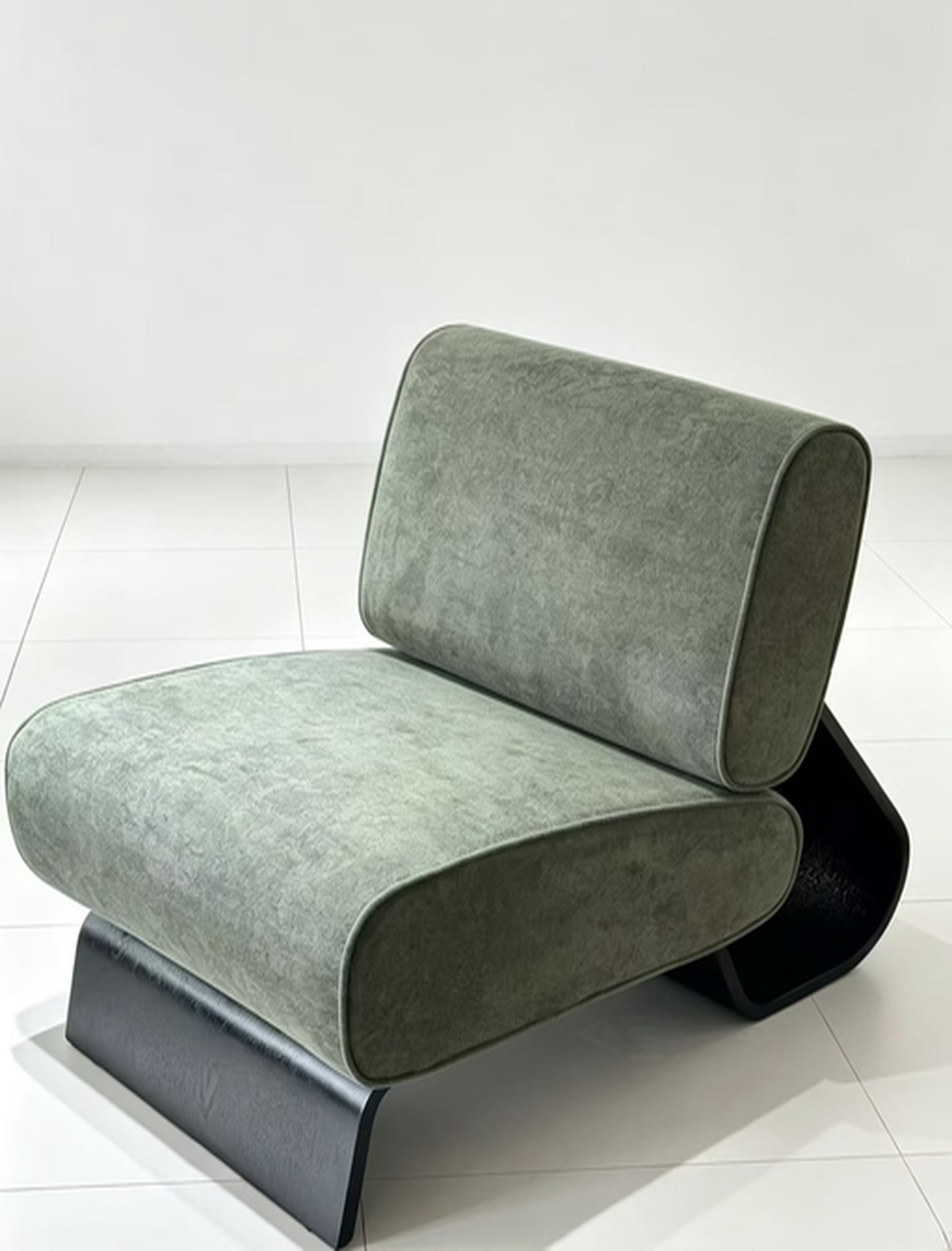 Sage green velvet accent chair with sculptural curved bentwood base, front view